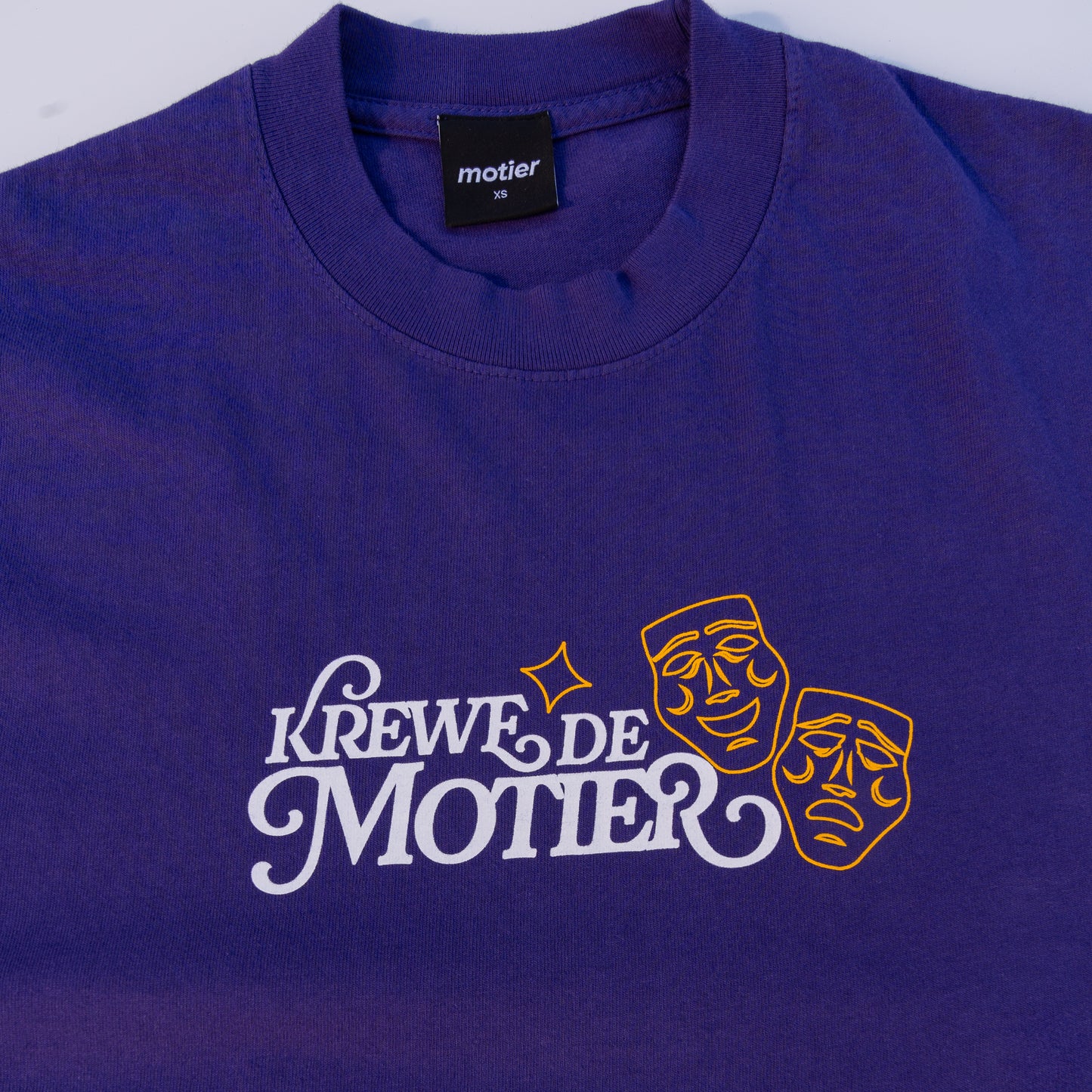The Krewe De Motier 2025 Luxe Tee (Purple) - Motier Lafayette 