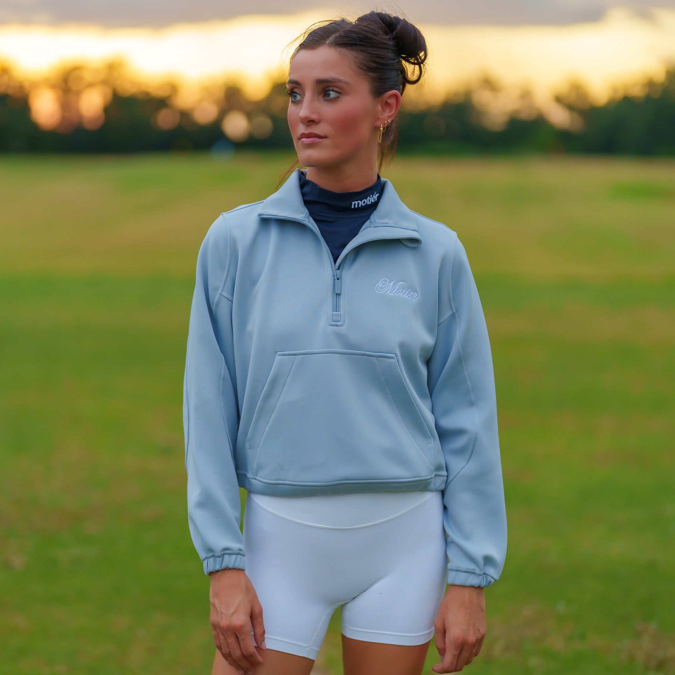 Motier Lafayette Grand Script Scuba Quarter Zip sweater in sky blue, featuring a stylish fit and logo detail.