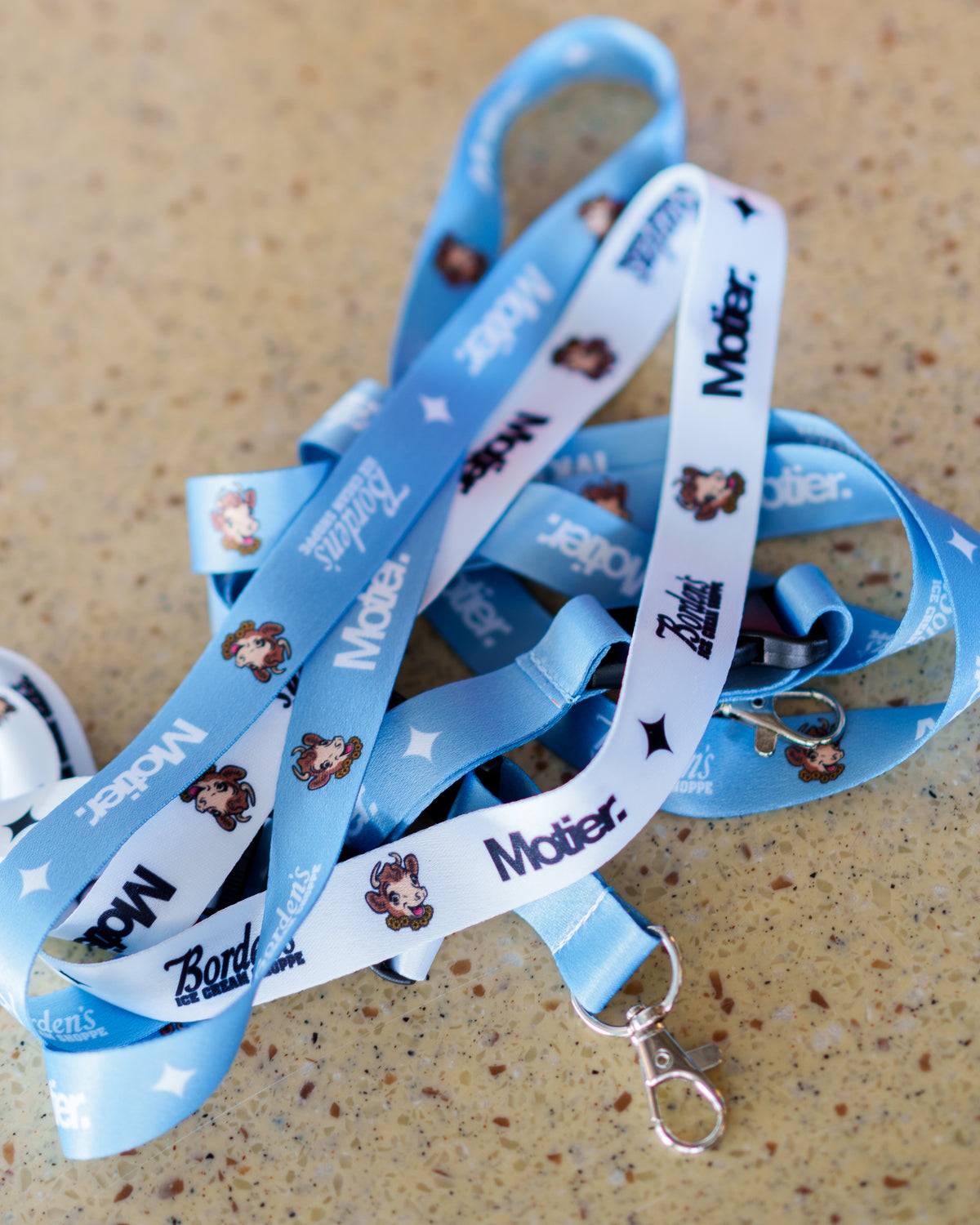 Motier Lafayette Borden's Ice Cream Shoppe lanyard featuring colorful design and branding, ideal for holding ID badges or keys.