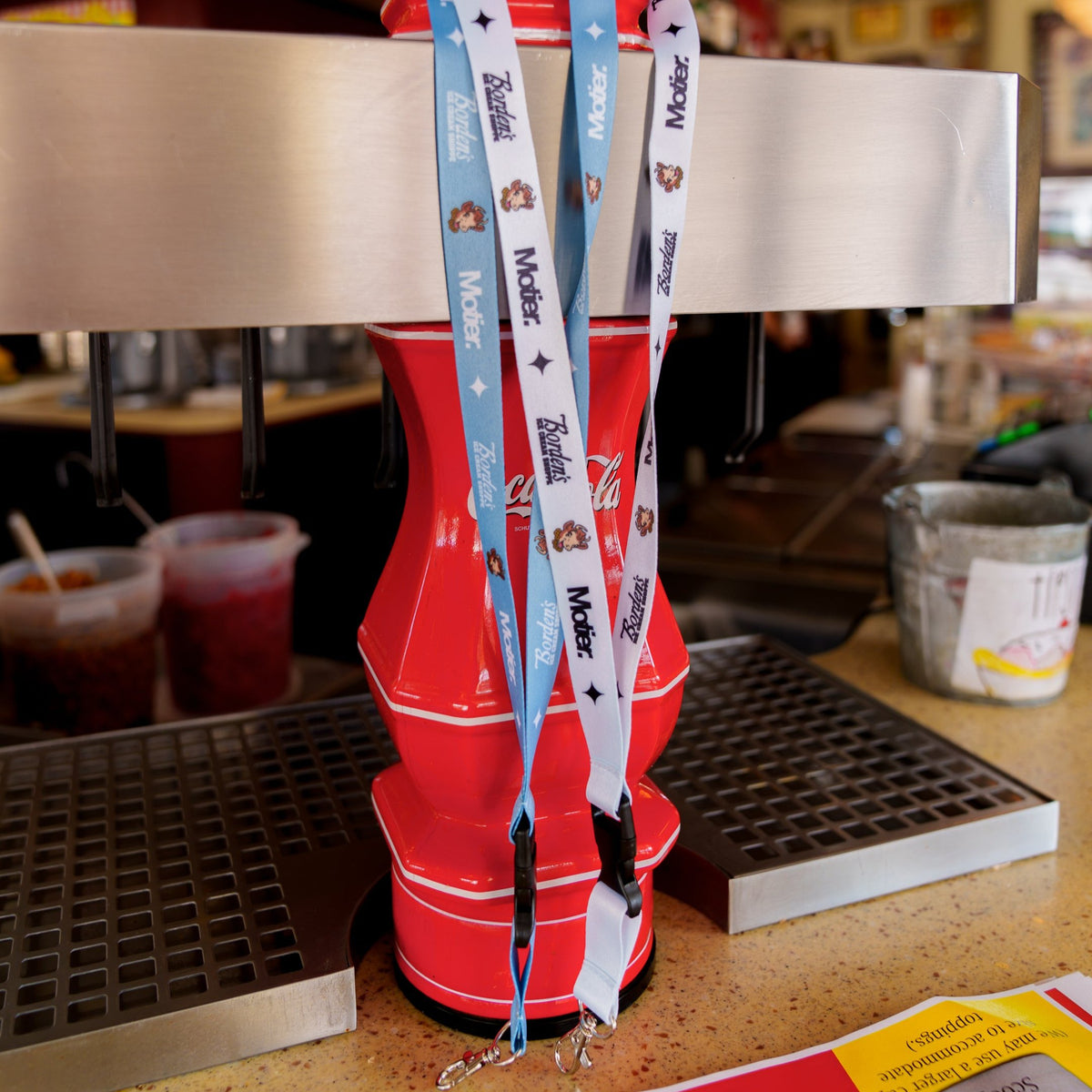 Motier Lafayette Borden's Ice Cream Shoppe lanyard with colorful design and branding, suitable for holding ID badges or keys.