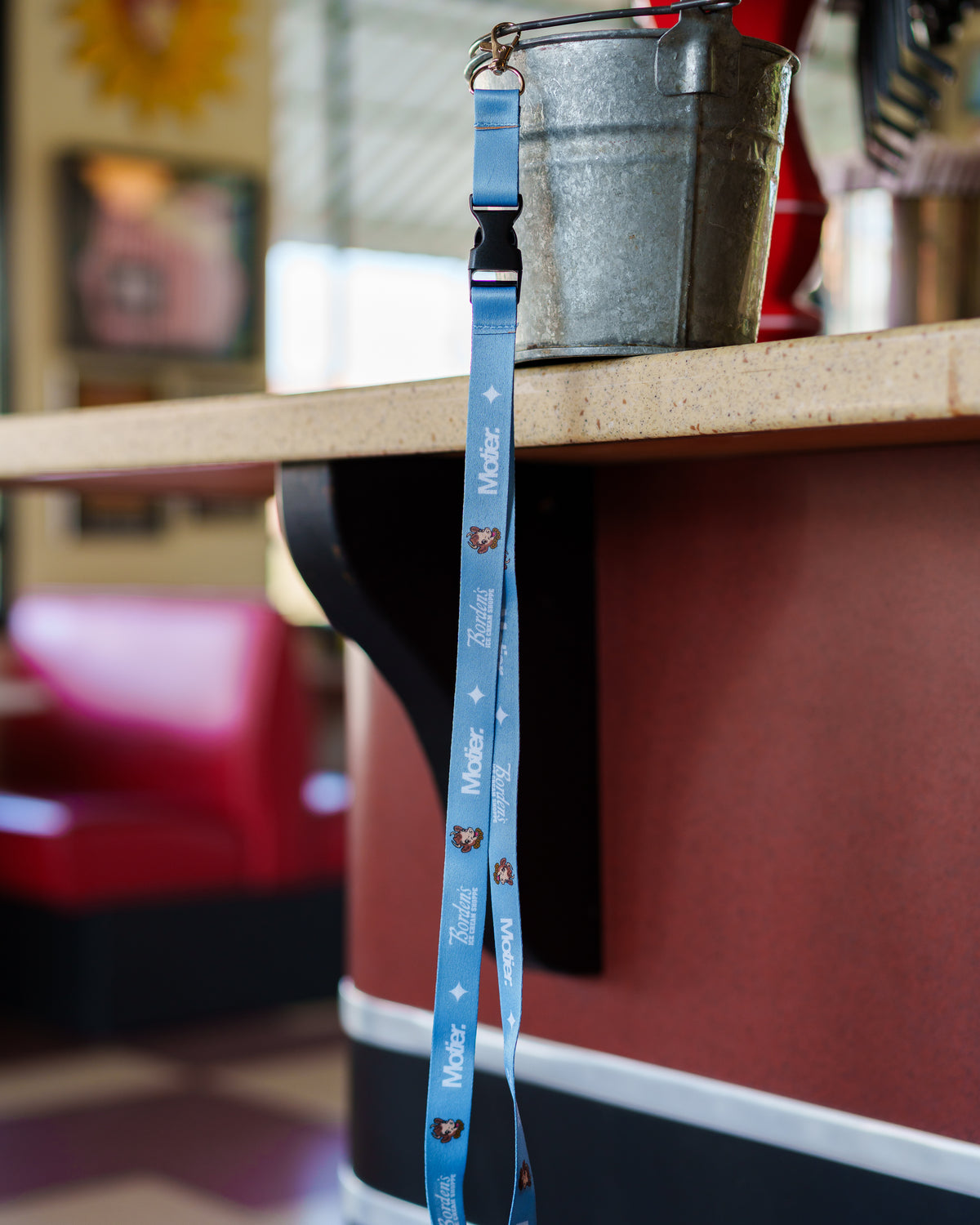 Motier Lafayette Borden's Ice Cream Shoppe lanyard with colorful ice cream cone design and branding for staff or promotional use.