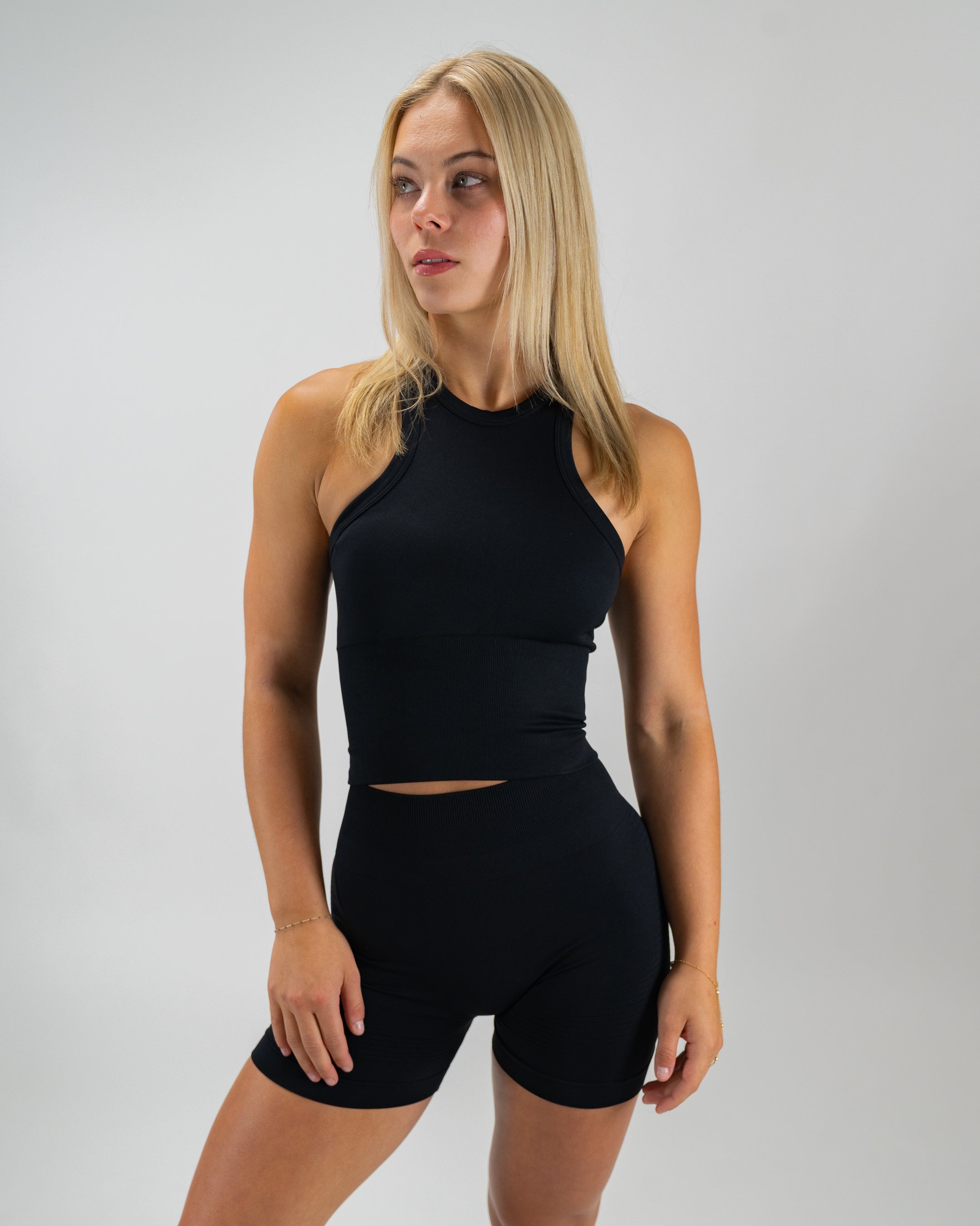 Black Seamless Sculptflex Biker Shorts by Motier Lafayette, close-up view highlighting stretchy, smooth fabric and fitted design.