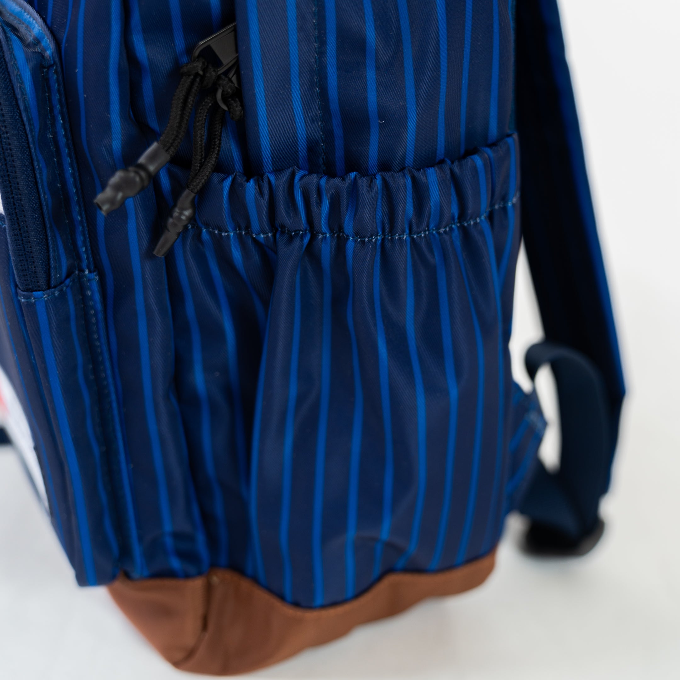 Navy Motier Lafayette The Legacy II Pinstripe Backpack with leather accents and multiple compartments on a plain background.
