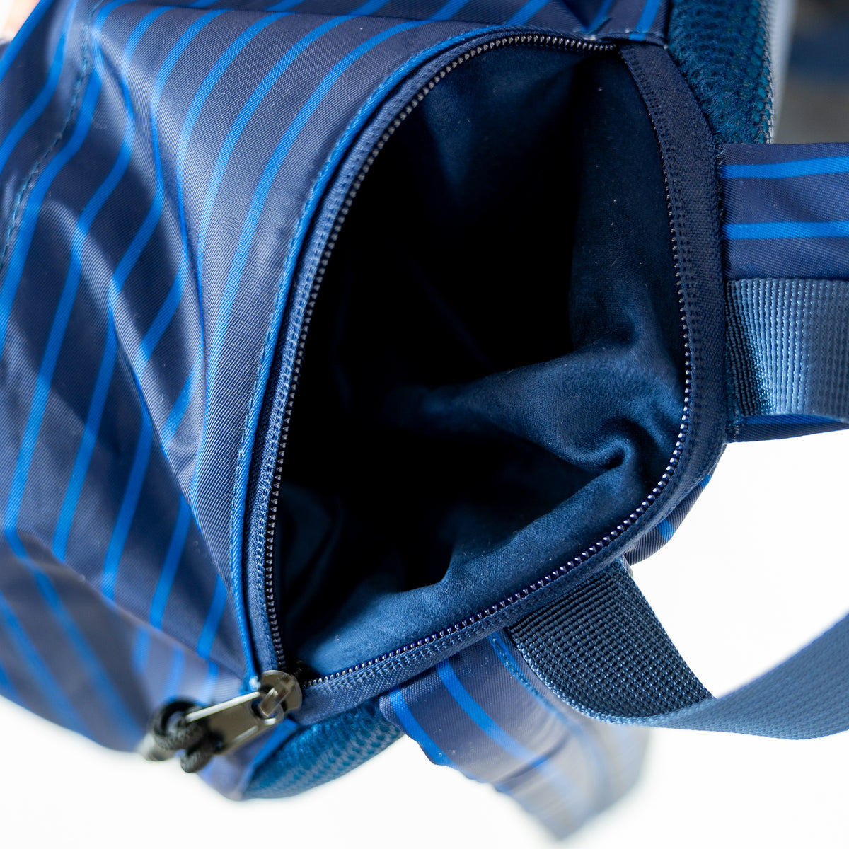 Navy pinstripe backpack from Motier Lafayette's The Legacy II collection with multiple compartments and adjustable straps.