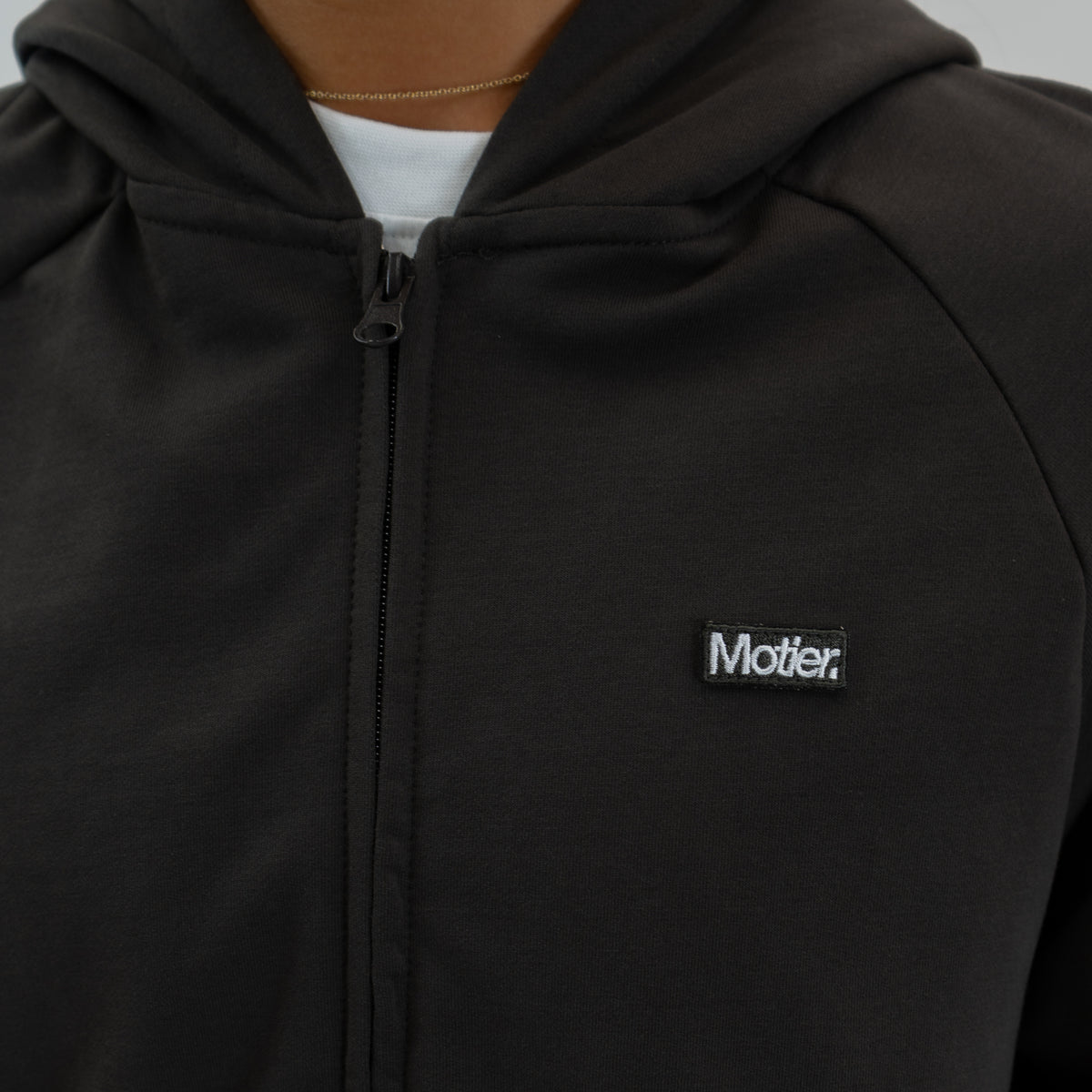 Motier Lafayette Refresh Full-Zip Hoodie in Brownstone, shown in asphalt color with front zipper and soft fabric.