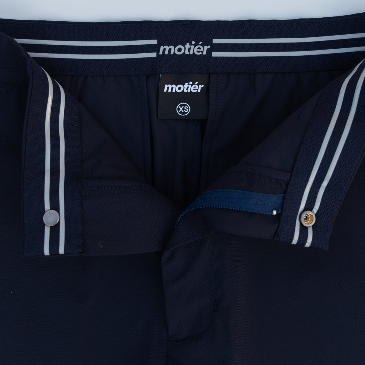Navy Rusty Marquis pants by Motier Lafayette, showcasing a stylish fit with tailored design and functional pockets.