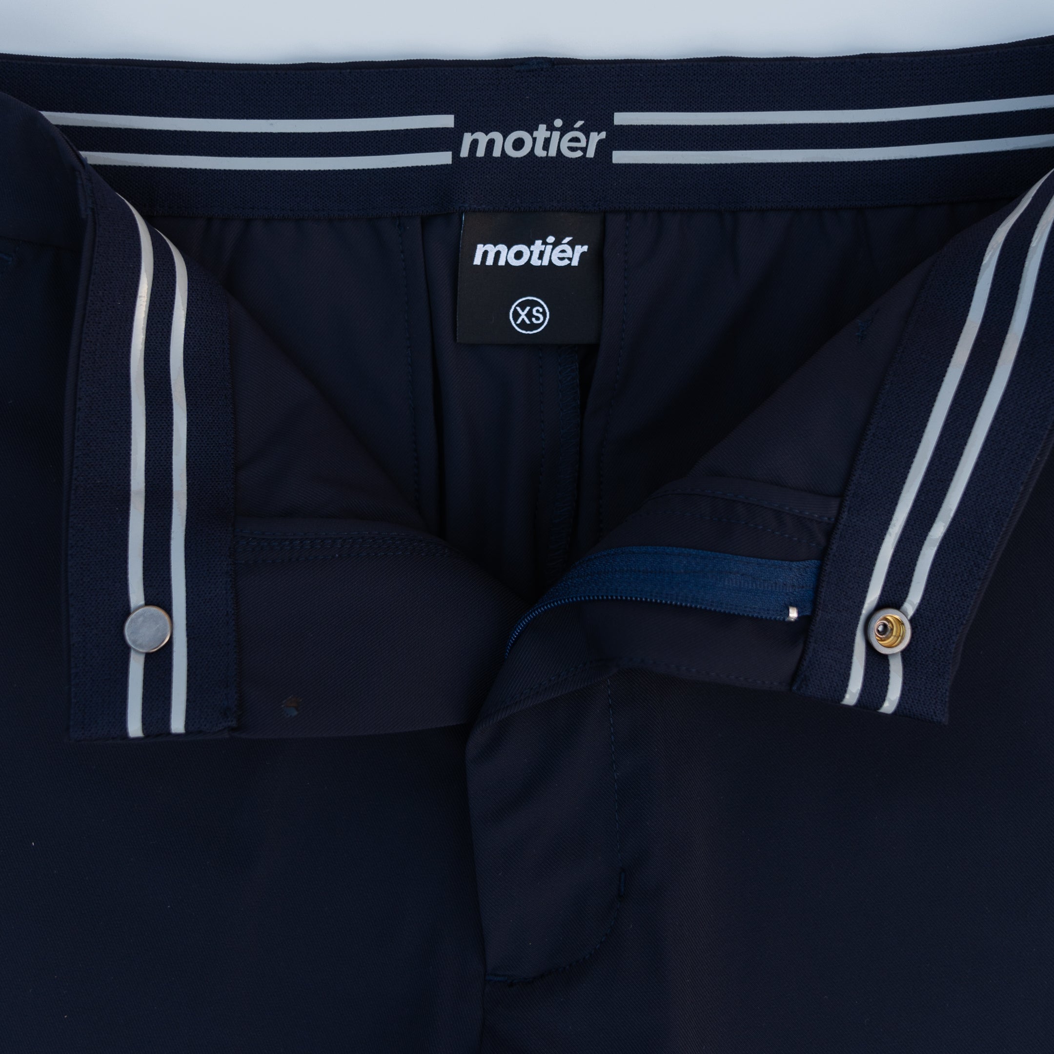 Navy Rusty Marquis pants by Motier Lafayette, showcasing a stylish fit with tailored design and functional pockets.