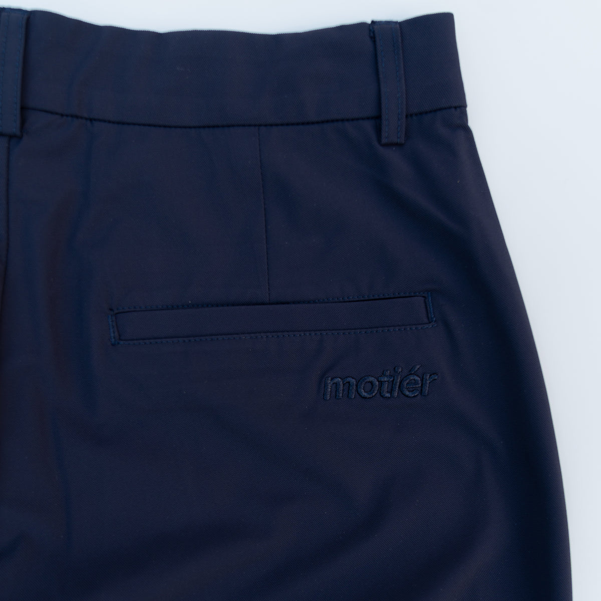 Motier Lafayette Rusty Marquis Navy pants displayed on a model, showcasing a stylish fit and classic design.