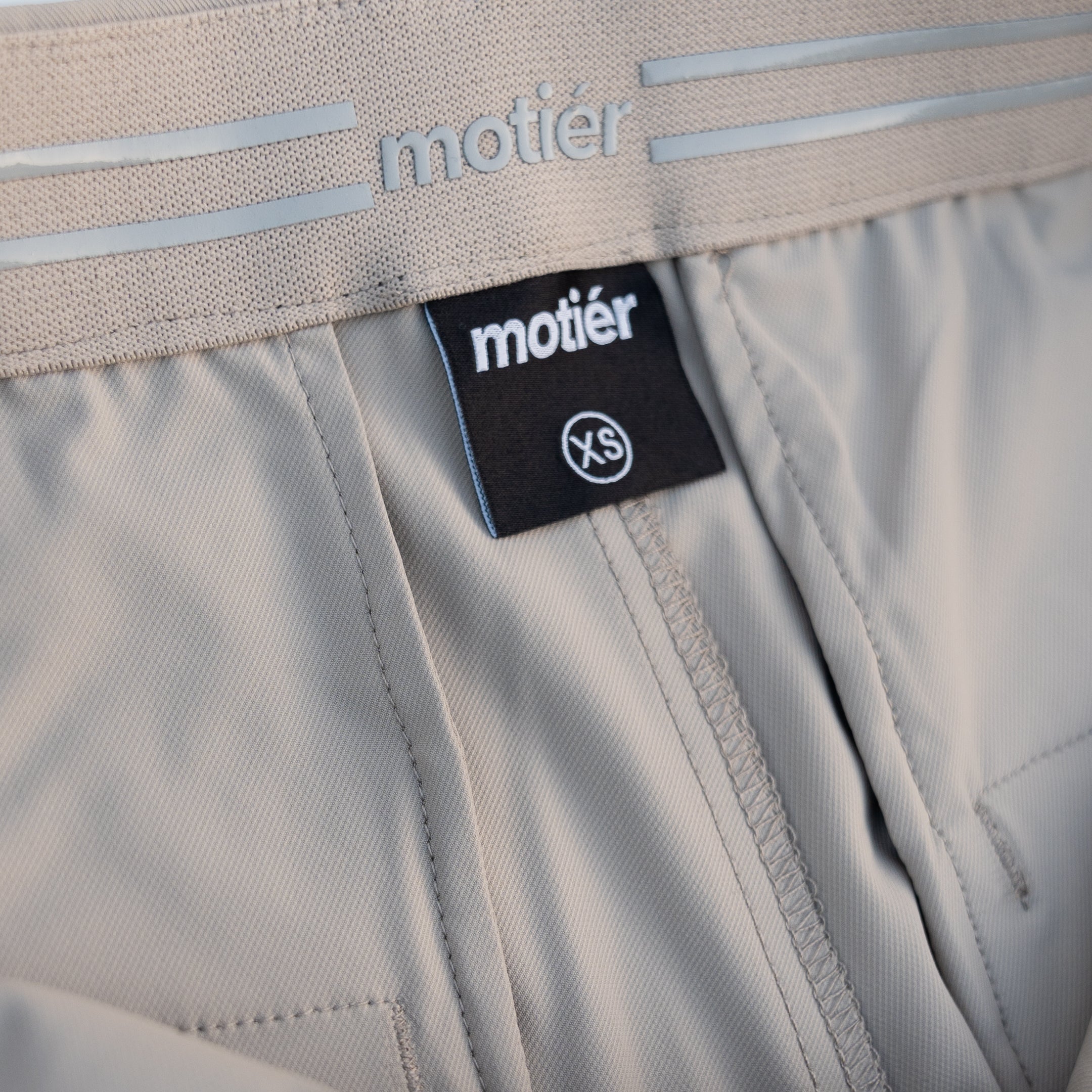 Motier Lafayette Rusty Marquis Pant in tan, slim-fit pants with classic design and durable fabric, shown on a model.