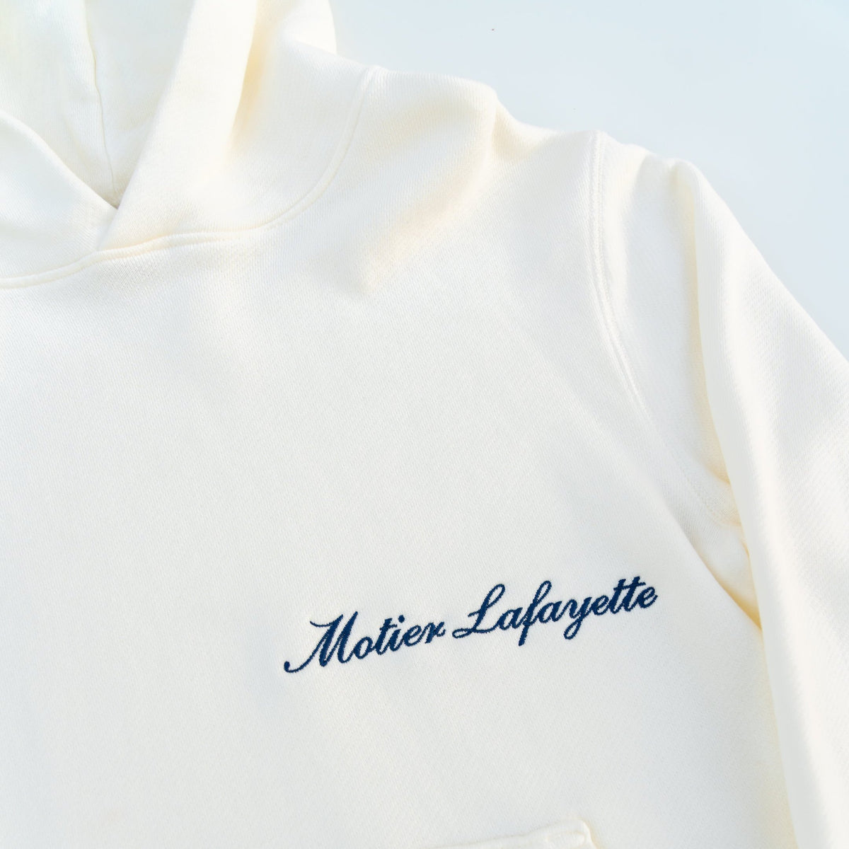 Motier Lafayette Ellington Vintage Luxe Hoodie in Blanc, featuring a cozy, stylish design with a soft fabric texture and casual fit.