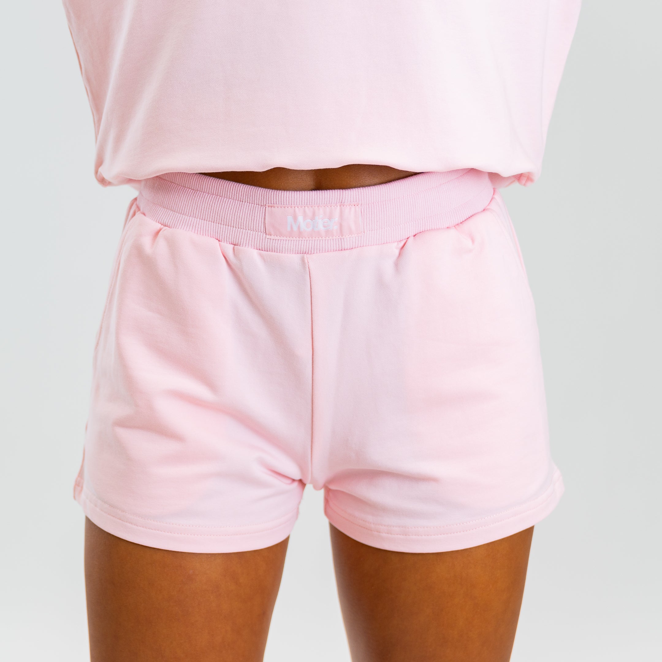 Motier Lafayette The Refresh Shorts in blush pink, lightweight fabric with a relaxed fit, perfect for casual summer wear.