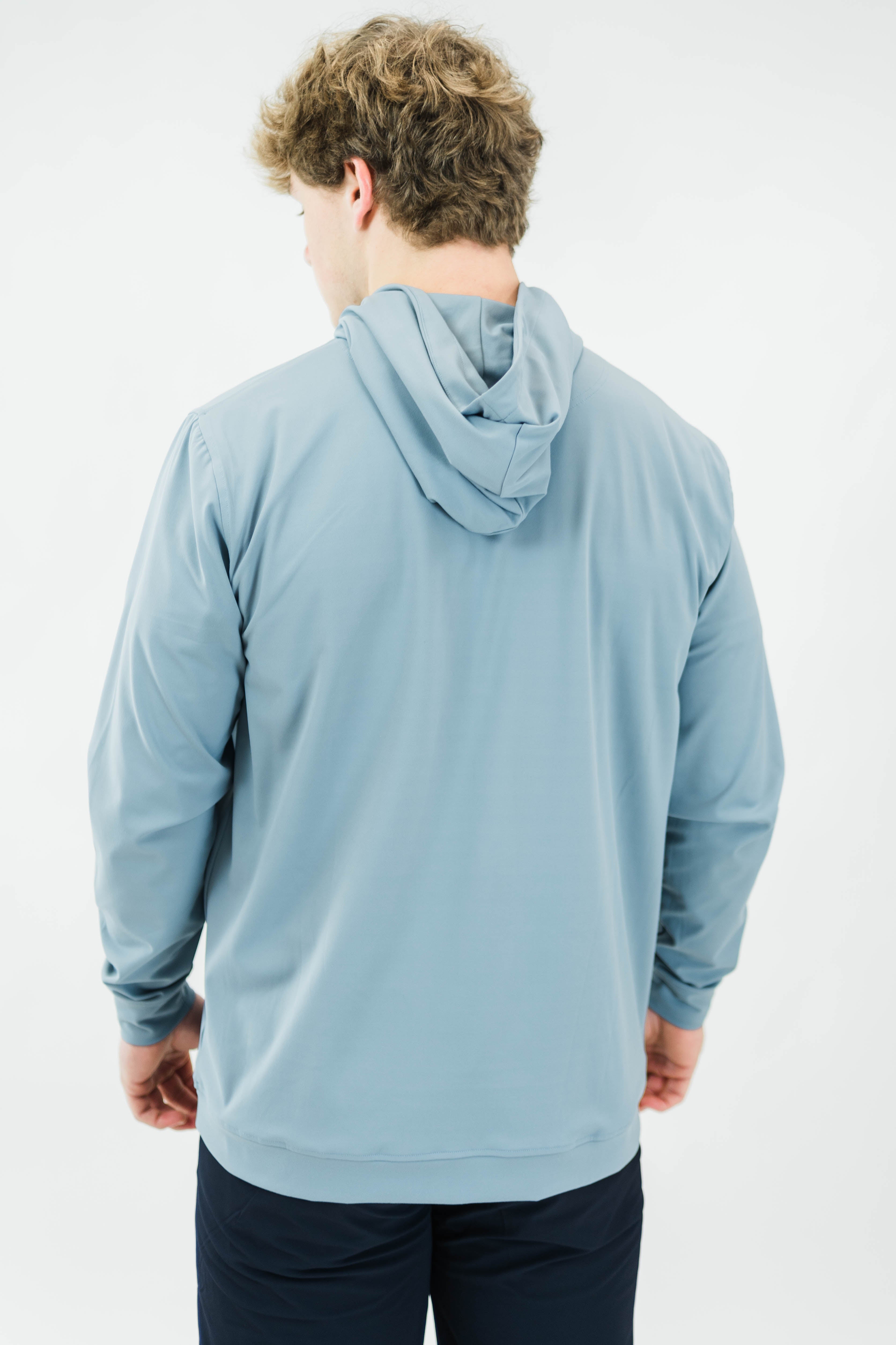 Motier Lafayette Riviera Lightweight Performance Hoodie II in slate blue, shown on a model, featuring a casual fit and athletic design.