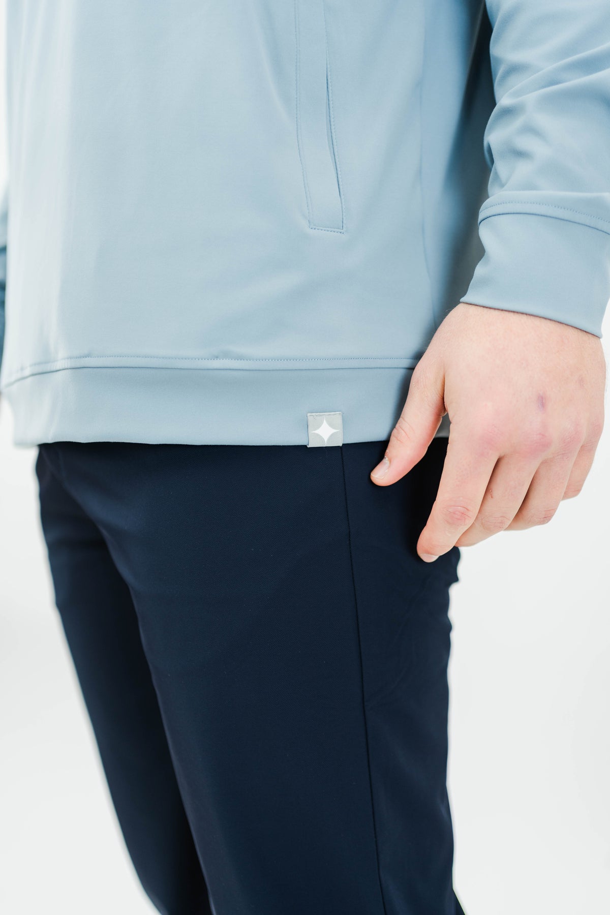 Motier Lafayette Riviera Lightweight Performance Hoodie II in slate blue, showing a close-up of the hoodie’s fabric and design details.