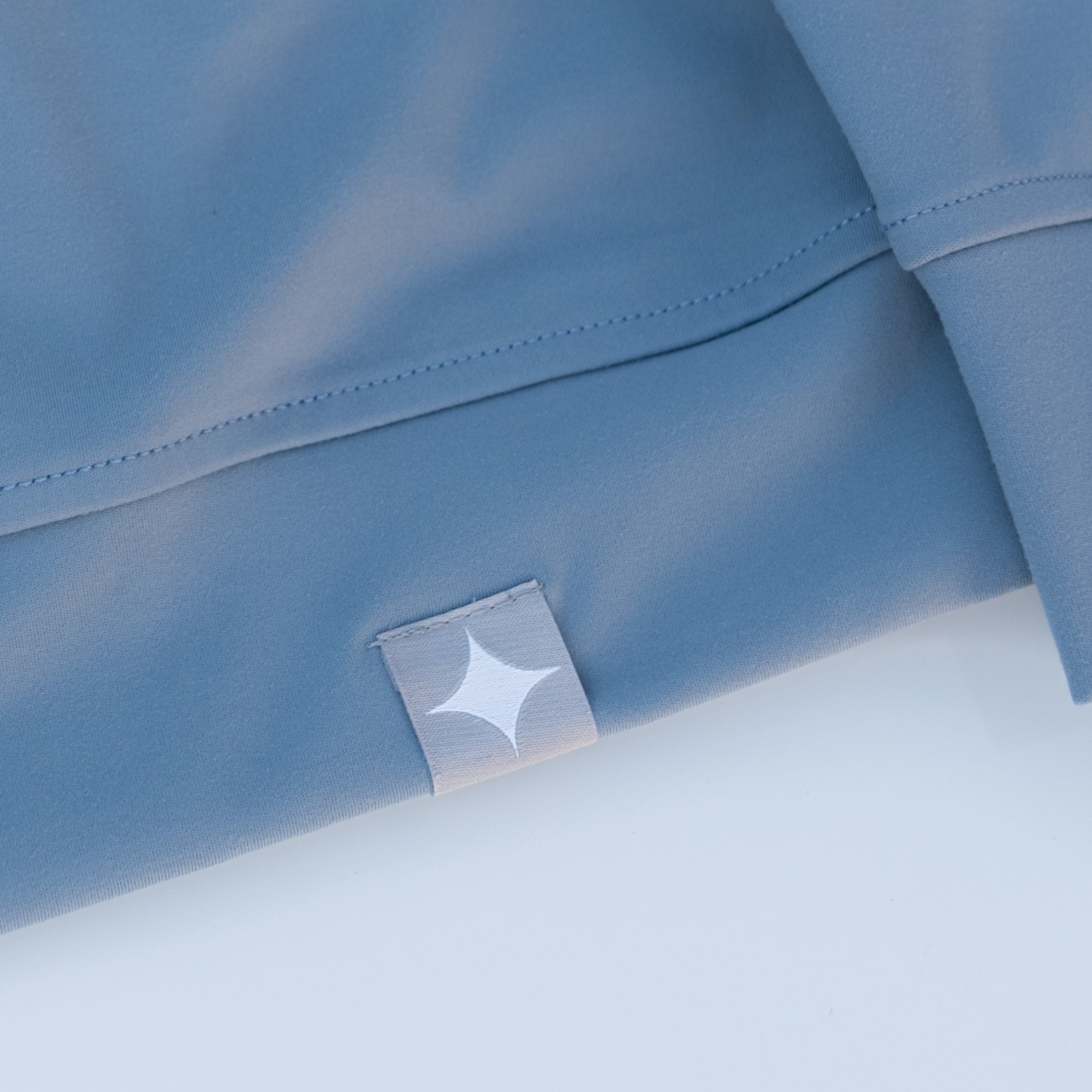 Motier Lafayette Riviera Lightweight Performance Hoodie II in slate blue, showing the hood, zipper, and casual fit.