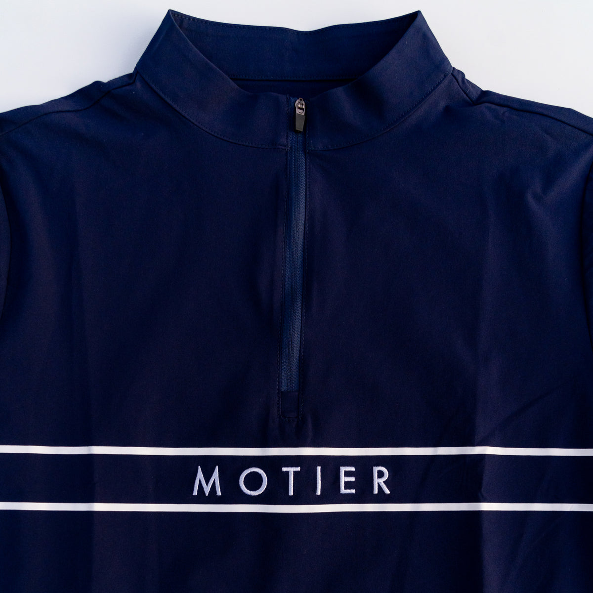 Navy Thomas Élite Pullover by Motier Lafayette, close-up of soft knit fabric and classic crew neck design.