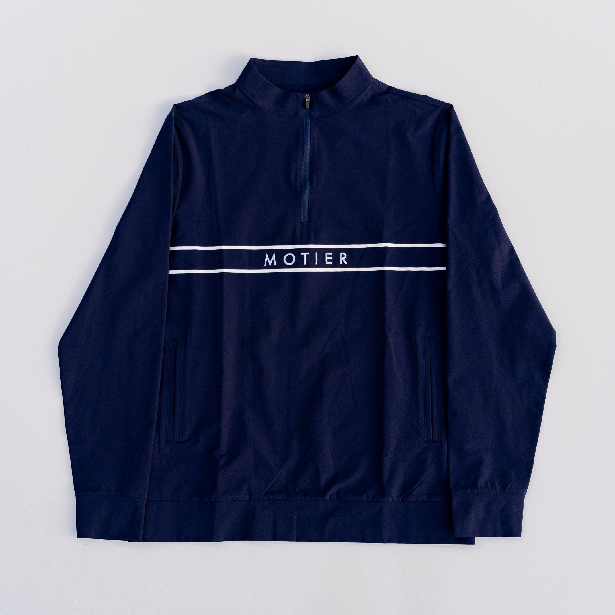 Navy Thomas Élite Pullover by Motier Lafayette, showcasing a stylish knit sweater with a crew neckline and textured design.
