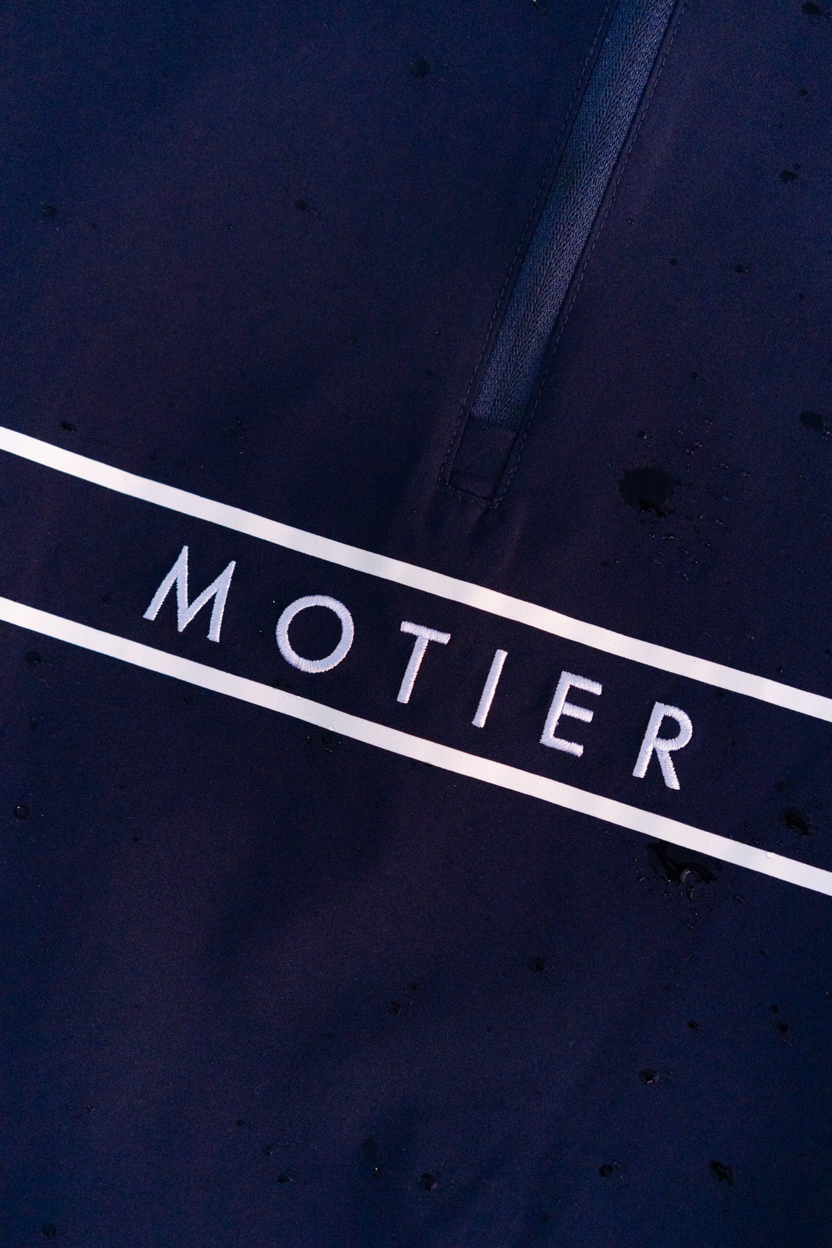 Navy Thomas Élite Pullover by Motier Lafayette, close-up of soft knit fabric and ribbed cuffs on a casual men's sweater