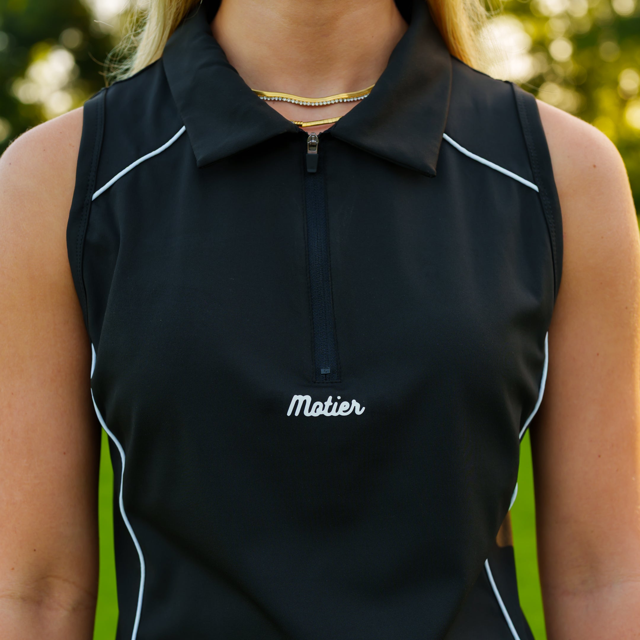 Black Motier Lafayette Performance Zip Polo shirt with a quarter-zip collar and athletic fit.