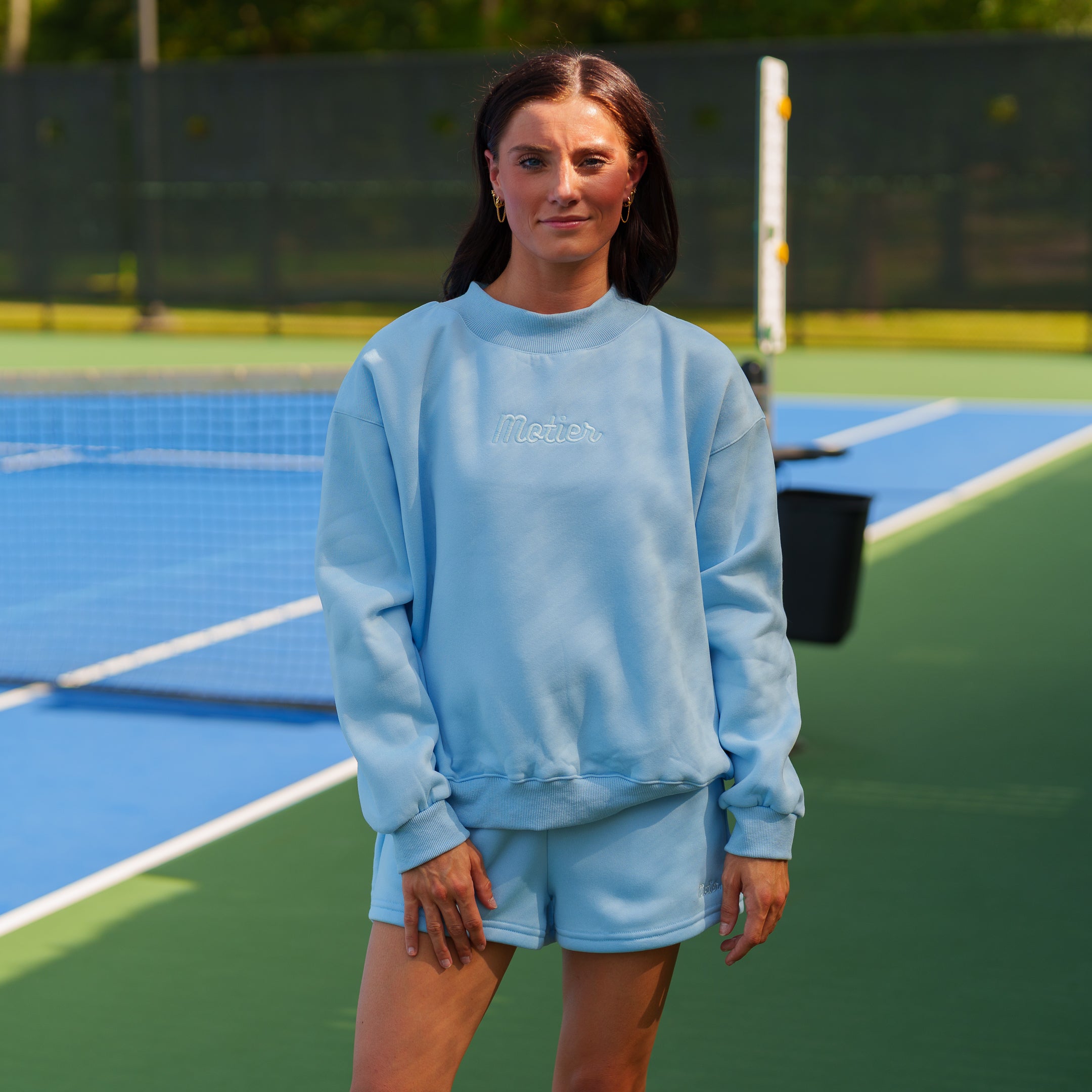 Sky blue Script Mock Neck sweater by motierlafayette featuring a ribbed neckline and soft knit fabric.