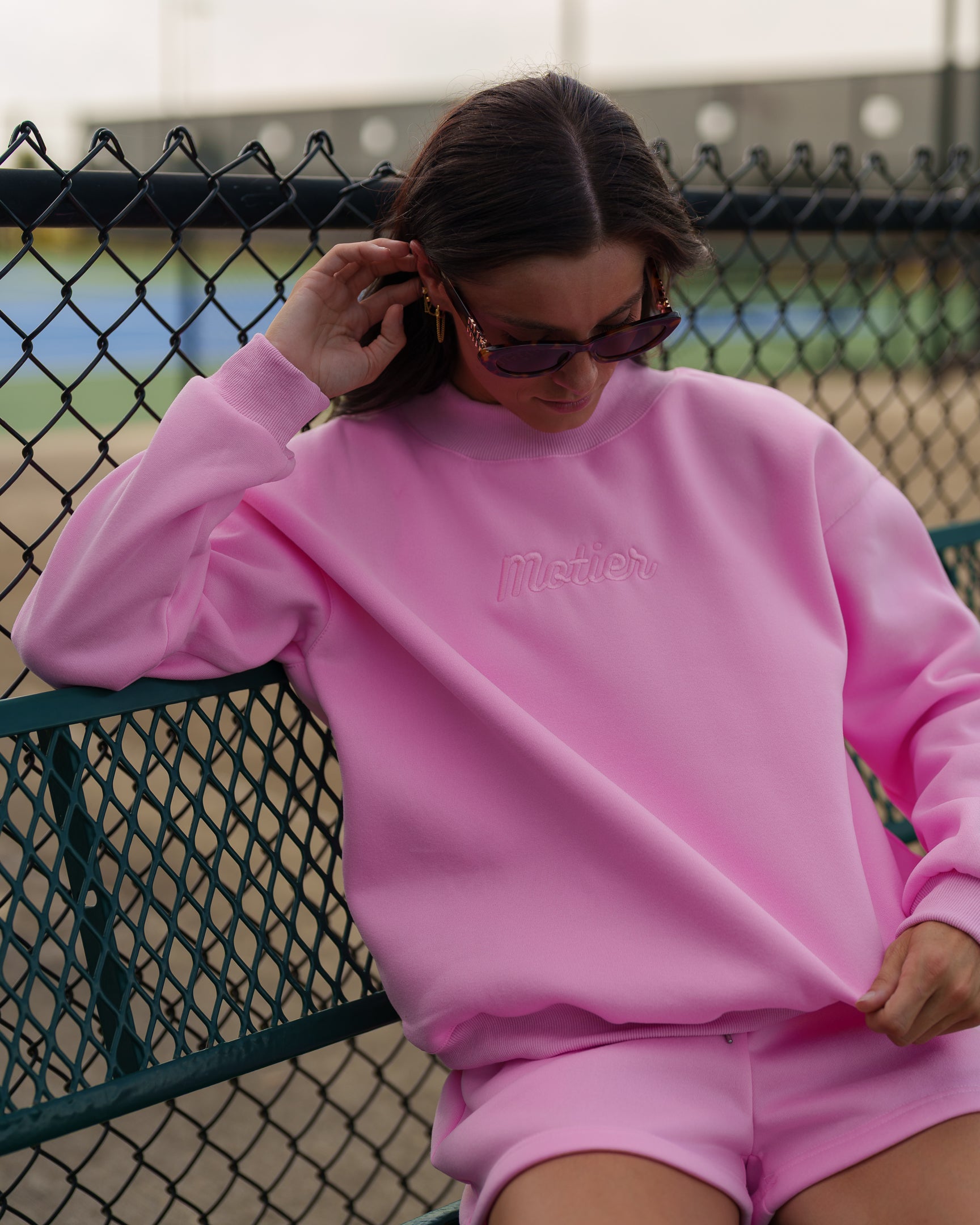 Pink The Pin Script Mock Neck Sweater by motierlafayette, featuring a stylish script design and cozy knit fabric.